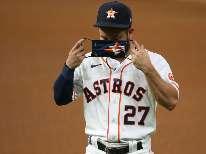 Jose Altuve puts a mask on